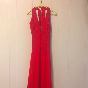 Red floor length gown by Niki. Only worn once in perfect condition.